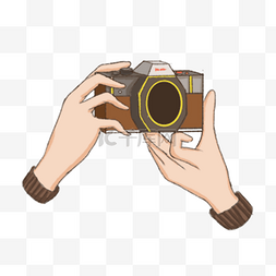 双手拍照棕色手持相机
