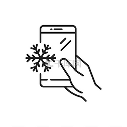 小图标单色图片_智能手机在手与雪花在屏幕上孤立