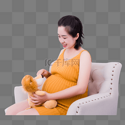 孕妇美女沙发坐着玩布偶