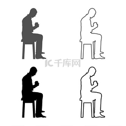 坐在凳子上的男人图片_男人拿着杯子坐在凳子上看着里面