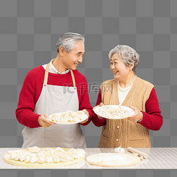 厨房准备年夜饭包饺子的老年夫妻