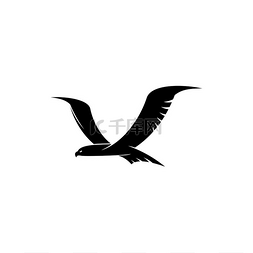 中剪影图片_飞行中的黑鸟是一个孤立的纹章符