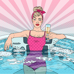 美丽的女人喝香槟在水力按摩池。