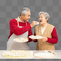 除夕在厨房里包饺子的老年夫妻