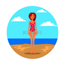 泳装女图片_穿着圆点图案泳装的女孩站在海滩