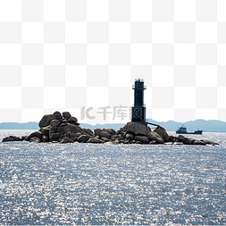 海洋岩石图片_海岛海面上的灯塔