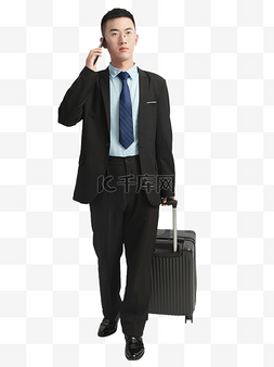 行李箱图片_出差打电话的商务男人