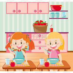 两个孩子在厨房里吃早餐