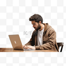坐在桌子图片_一名男子坐在桌子旁，使用笔记本