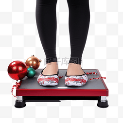 體重秤图片_女脚站在电子秤上，穿着圣诞装饰
