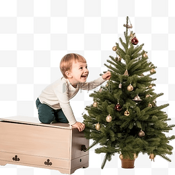 儿童墙面装饰图片_小男孩爬上玩具箱来装饰圣诞树