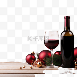 起泡酒酒瓶图片_木桌上的红酒和圣诞装饰品