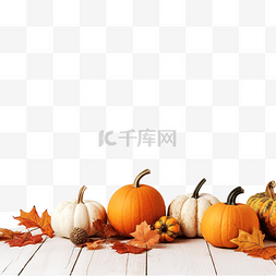 白色木桌上的秋天南瓜和叶子