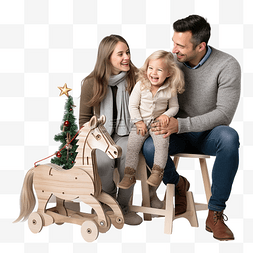 马上开抢图片_一个小孩坐在她父母旁边圣诞树附