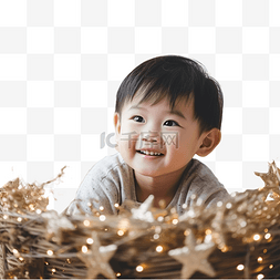 金色圣诞星星图片_男孩微笑的模糊照片，同时看着圣