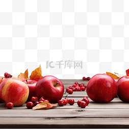 桌上的花图片_秋季户外木桌上的红苹果