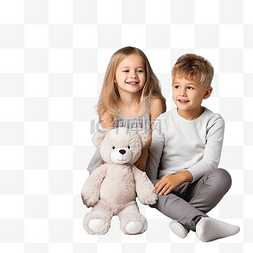 坐在餐桌旁的孩子图片_兄弟姐妹带着毛绒玩具坐在圣诞树