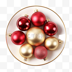 松枝圣诞球图片_盘子上的红色和金色圣诞球