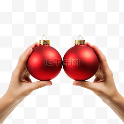 红金色球图片_女手拿着两个金色圣诞树小玩意穿