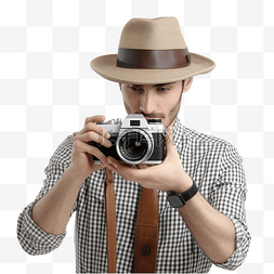 复古攝影图片_戴着软呢帽的摄影师瞄准复古单反