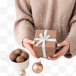 纯手工饺子图片_圣诞女手拿着礼盒和一杯可可