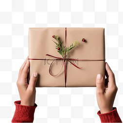 圣诞手工图片_女手用纸包裹圣诞手工礼物