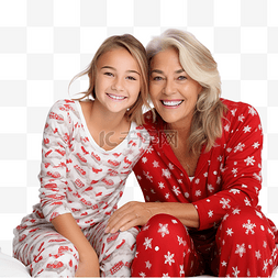 人床图片_穿着传统圣诞睡衣的祖母和孙女坐