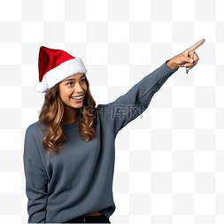 在笑的女人图片_戴着圣诞帽的女孩在孤立的蓝墙上