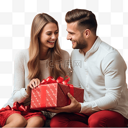 坐着的恋人图片_年轻快乐的夫妇带着礼物坐在家里