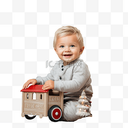 小孩坐火车图片_英俊的白人小孩坐在豪华圣诞树前