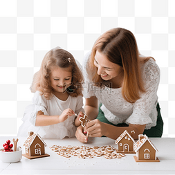 母亲和小女孩装饰圣诞姜饼屋