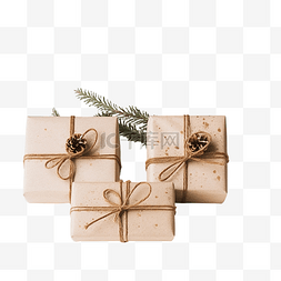 圣诞节松树枝图片_圣诞礼物包装和装饰，白桌上有喜