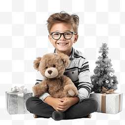 戴眼镜和泰迪熊的男孩坐在圣诞树