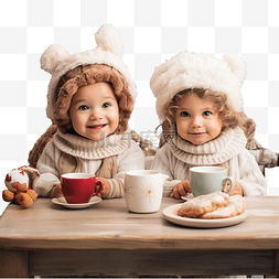 两个女孩子图片_两个女婴在圣诞厨房吃早餐