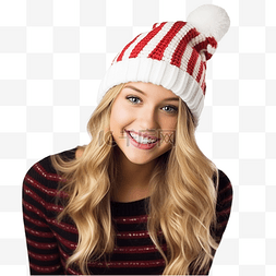 圣诞糖拐杖图片_在圣诞集市上，戴着红色针织帽拿