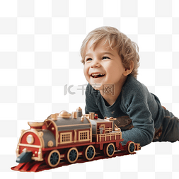 小男孩躺着玩玩具圣诞蒸汽火车