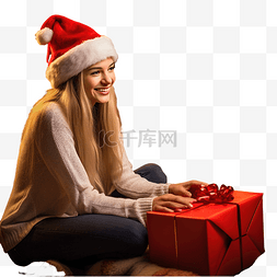 戴着圣诞帽的女孩坐在壁炉旁，拿