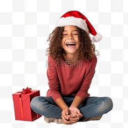 圣诞节假期的女孩坐在地板上笑