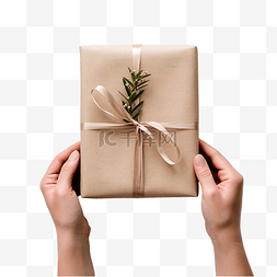 手工礼物图片_女手用纸包裹圣诞手工礼物