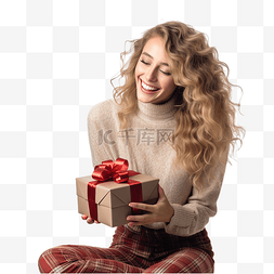 打开礼物的女孩图片_快乐的年轻女士在圣诞树附近打开
