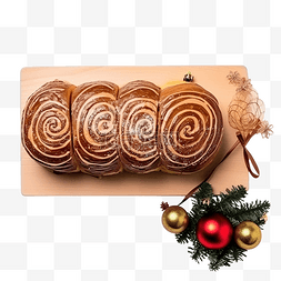 切块椰蓉蛋糕图片_圣诞装饰旁边的 bolo de rolo蛋糕卷