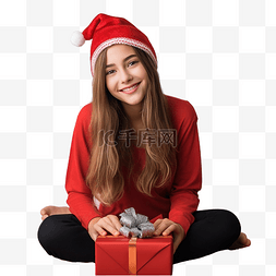 抱着礼盒的人图片_戴着红色圣诞帽带礼盒的女孩坐在