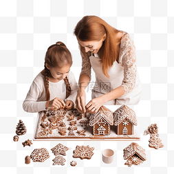 母亲和小女孩装饰圣诞姜饼屋