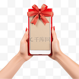 空白手机图片_拿着带圣诞礼物的空白手机的女手