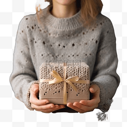 收纳盒图片_手穿毛衣，手里拿着一份带圣诞装