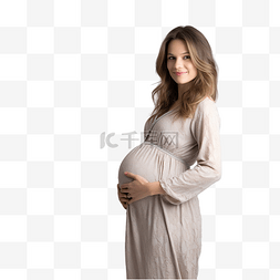 怀孕人图片_穿着睡衣的怀孕女孩在圣诞树附近
