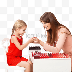 金色手指甲图片_圣诞节前，妈妈和女儿正在美容院