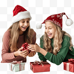 两个戴着圣诞帽的女孩正在包装圣