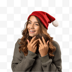 女孩耳朵图片_戴着圣诞帽的女孩在孤立的墙上听