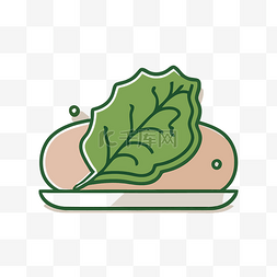 白盘上有一片菠菜叶的三明治的图